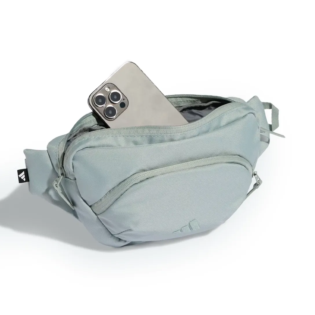 Pochete Adidas Prime aberta mostrando espaço interno e bolso com zíper